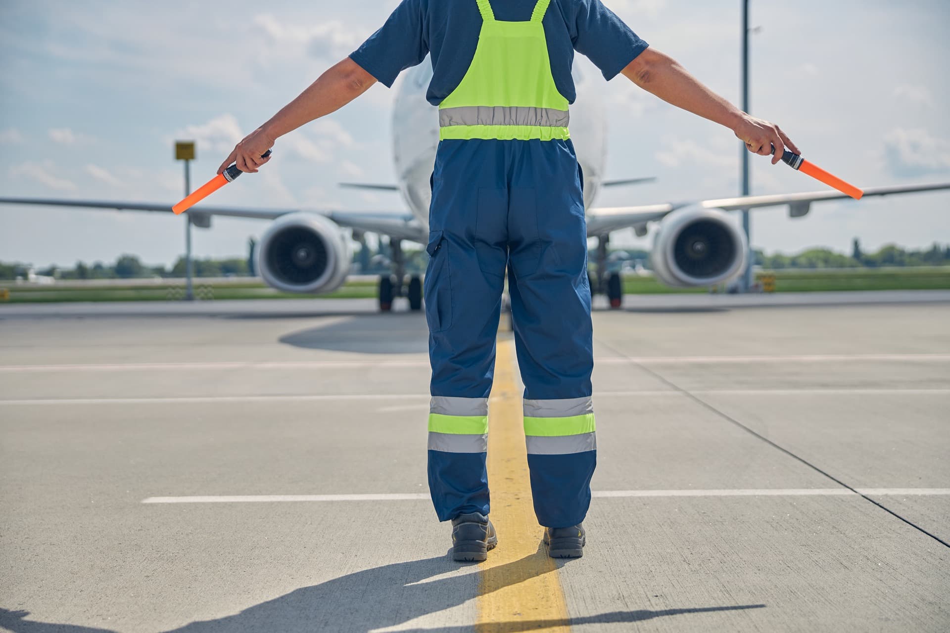 Ground crew directing aircraft