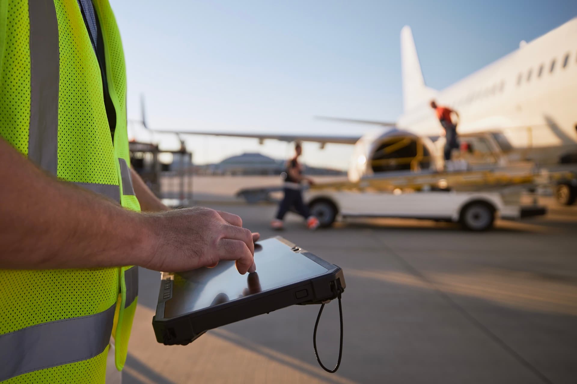 Airport worker with tablet